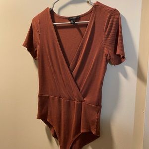 Maroon bodysuit.
